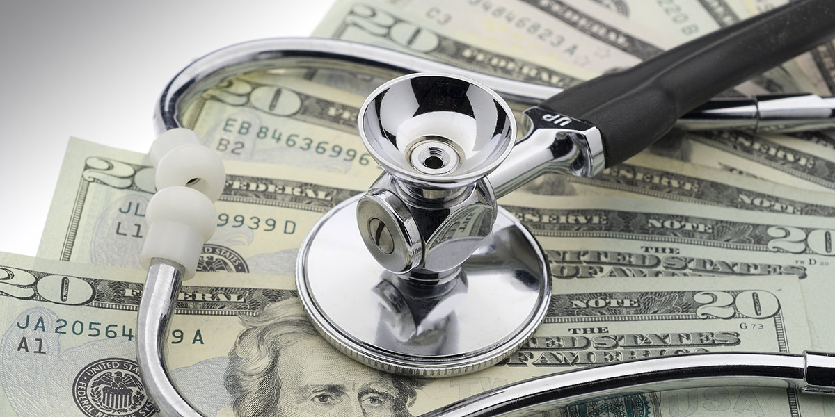 stethoscope on top of dollar bills