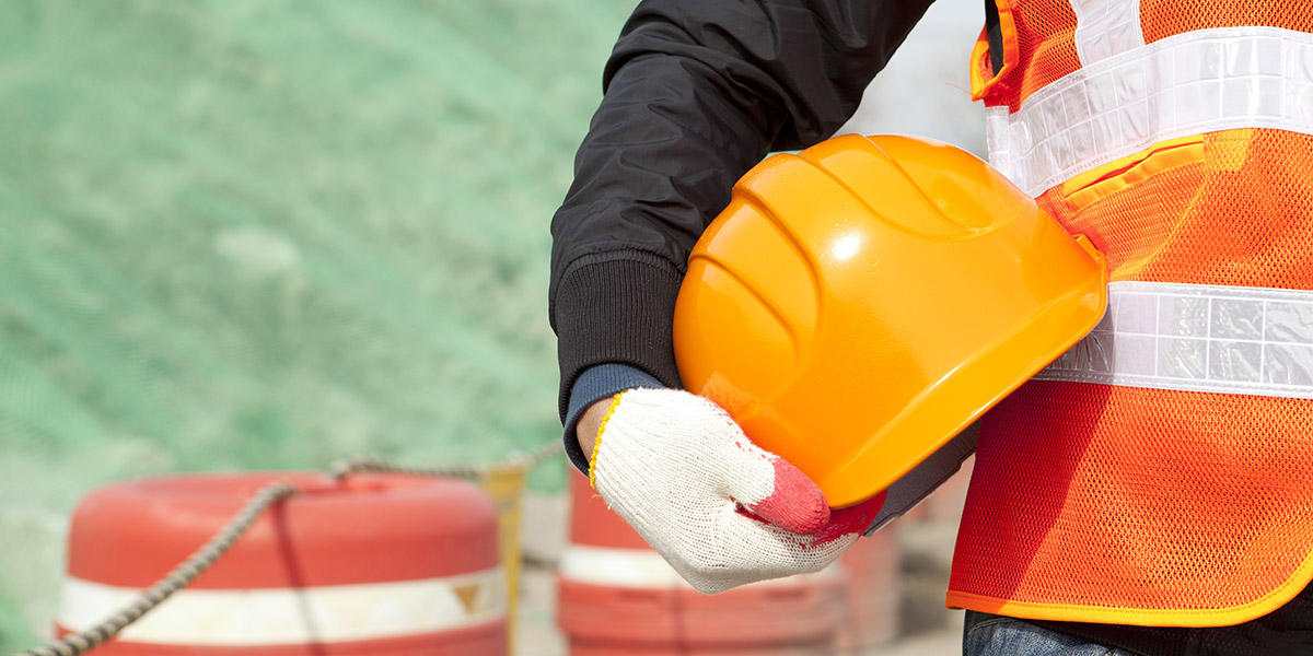 worker holding a hardhat