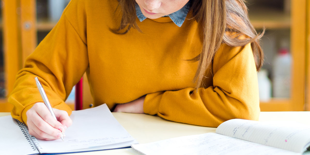Student taking notes