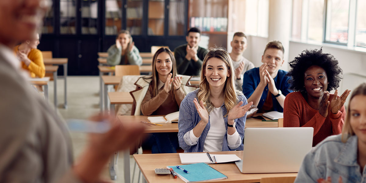 Students clapping in a classroom
