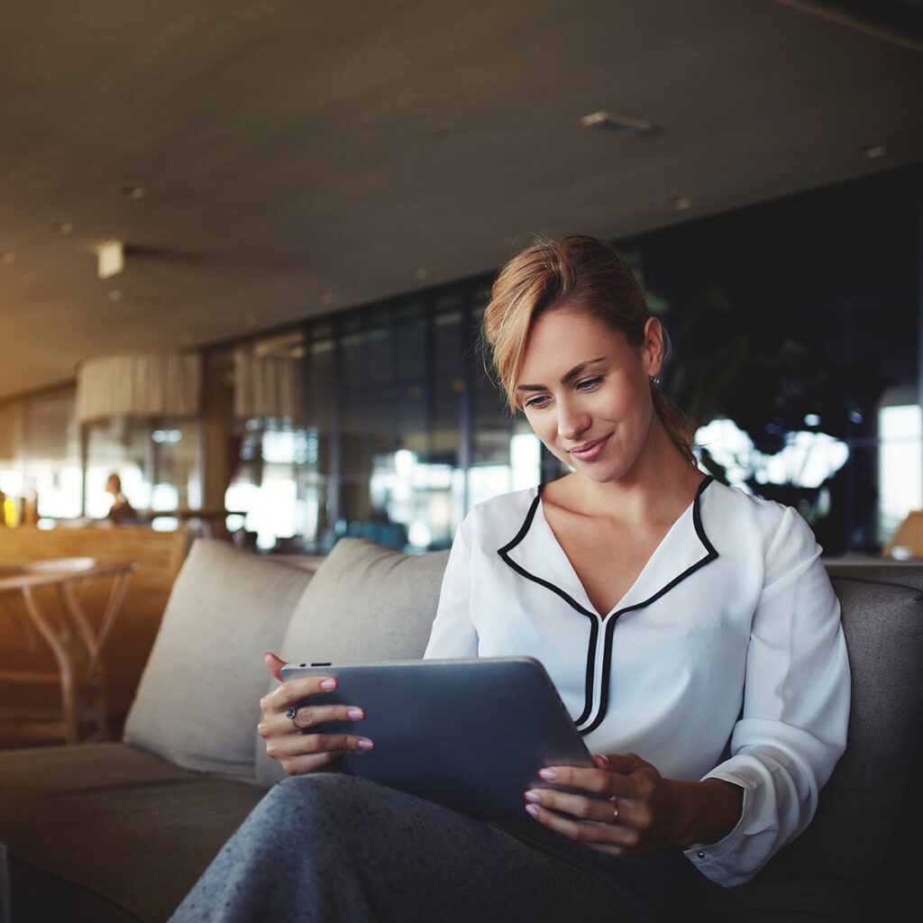 Woman reading on tablet